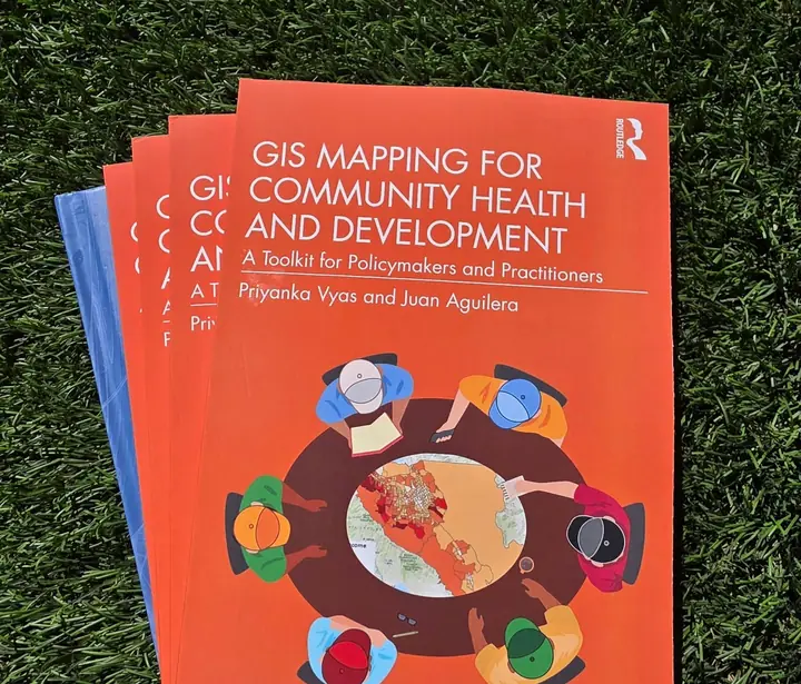 Copies of the book GIS Mapping for Community Health and Development by Priyanka Vyas and Juan Aguilera.