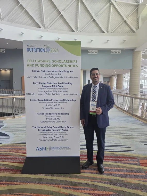 Dr. Aguilera beside the ASN 2025 fellowships and funding banner listing his Early Career Nutrition grant.